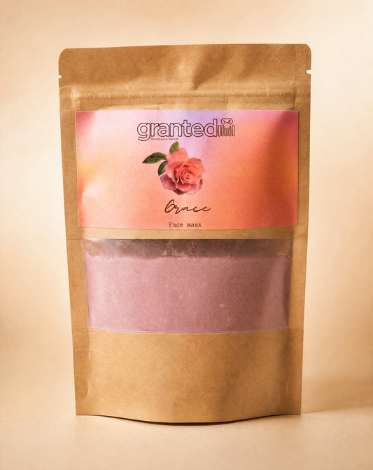 Kraft paper packaging of a face mask with a pink label featuring a rose and the brand name 'granted'.