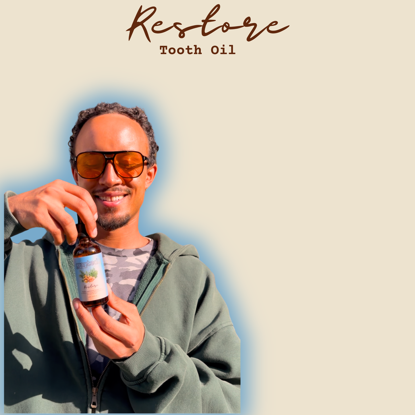 Man holding a bottle of 'Restore Tooth Oil' with a plain background