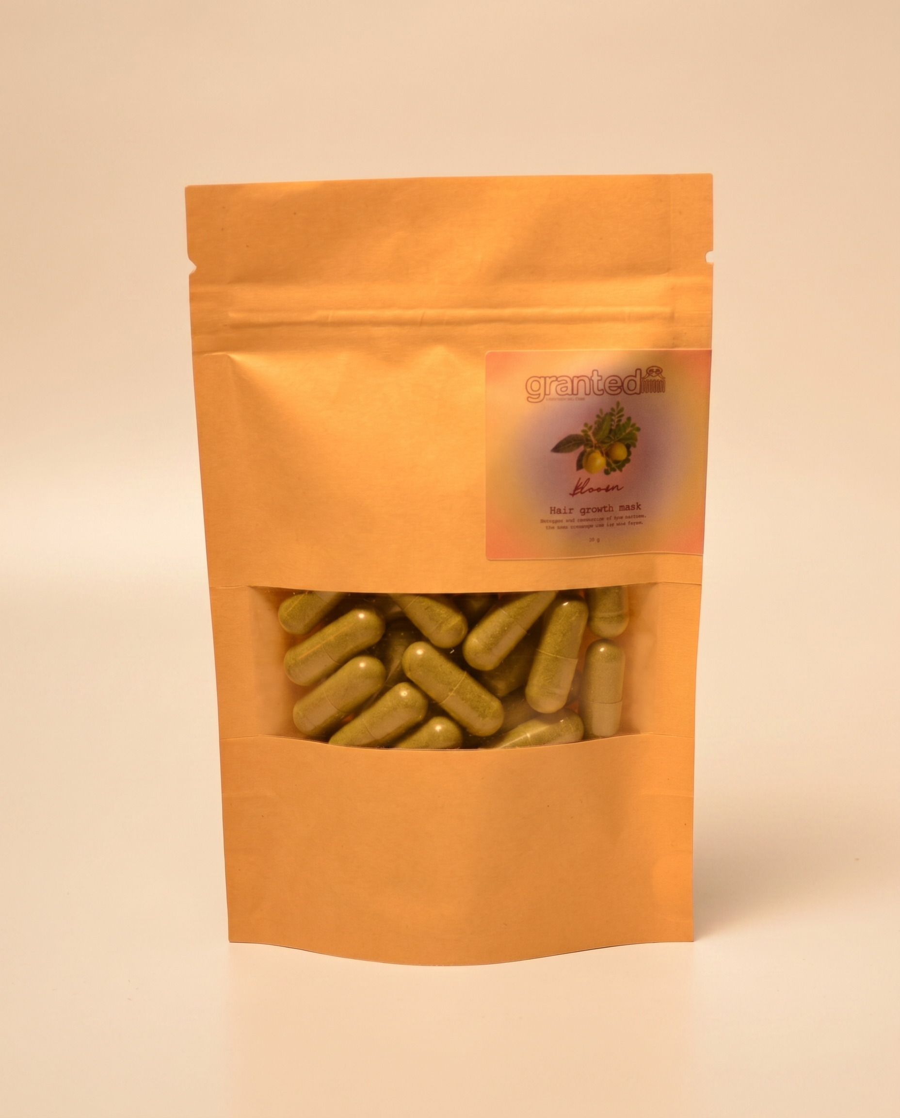 Orange packaging with green capsules and a label on a beige background