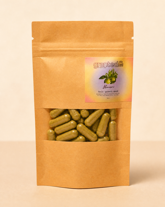 Kraft paper packaging with green capsules and a label on a beige background