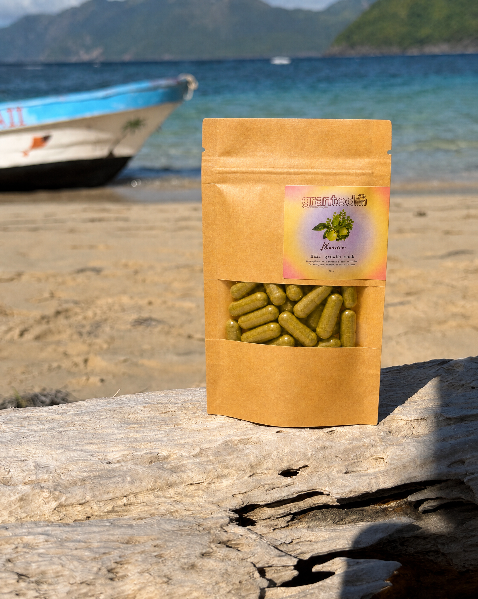 Packaged product on a beach with a boat and ocean in the background