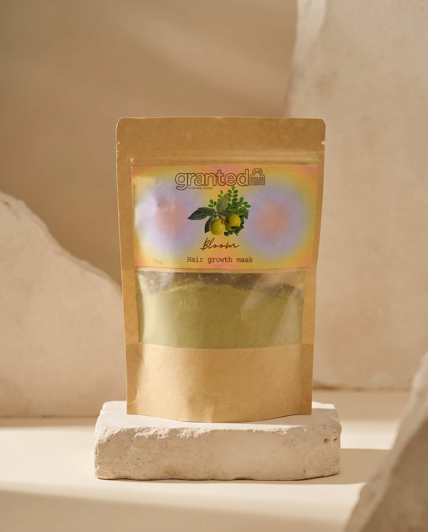 Kraft paper packaging of a hair growth mask with 'granted' branding on a neutral background