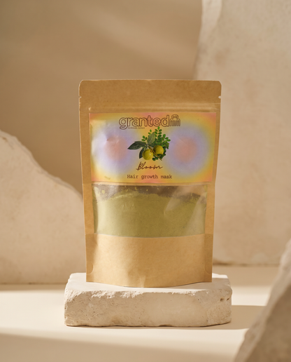 Kraft paper packaging of a hair growth mask with 'granted' branding on a neutral background